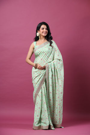 Shop mint green mulberry silk sari online in USA with embroidered border. Make a fashion statement at weddings with stunning designer sarees, embroidered sarees with blouse, wedding sarees, handloom sarees from Pure Elegance Indian fashion store in USA.-saree
