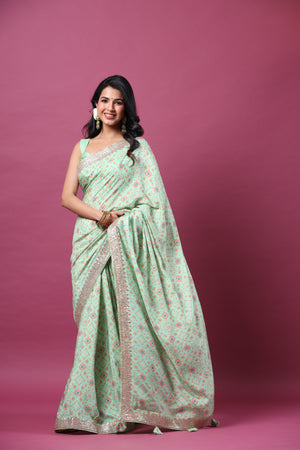 Shop mint green mulberry silk sari online in USA with embroidered border. Make a fashion statement at weddings with stunning designer sarees, embroidered sarees with blouse, wedding sarees, handloom sarees from Pure Elegance Indian fashion store in USA.-front