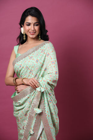Shop mint green mulberry silk sari online in USA with embroidered border. Make a fashion statement at weddings with stunning designer sarees, embroidered sarees with blouse, wedding sarees, handloom sarees from Pure Elegance Indian fashion store in USA.-closeup