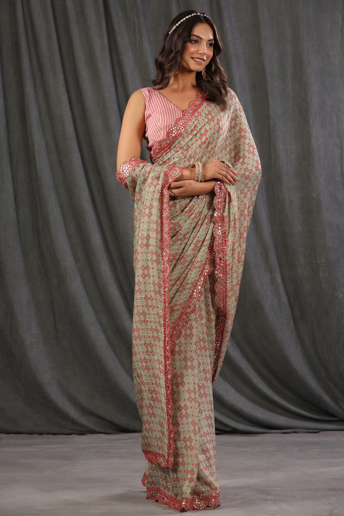 Shop pink green printed georgette saree online in USA with scalloped border. Make a fashion statement at weddings with stunning designer sarees, embroidered sarees with blouse, wedding sarees, handloom sarees from Pure Elegance Indian fashion store in USA.-full view