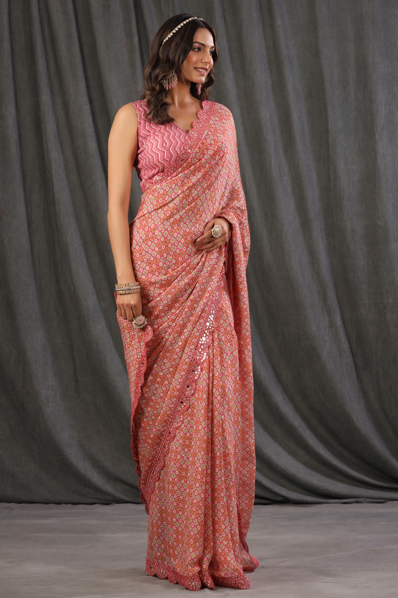 Buy pink printed crepe georgette saree online in USA with scalloped border. Make a fashion statement at weddings with stunning designer sarees, embroidered sarees with blouse, wedding sarees, handloom sarees from Pure Elegance Indian fashion store in USA.-side