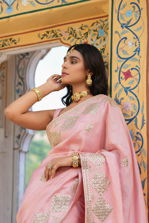 Shop baby pink embroidered tussar georgette saree online in USA with blouse. Make a fashion statement at weddings with stunning designer sarees, embroidered sarees with blouse, wedding sarees, handloom sarees from Pure Elegance Indian fashion store in USA.-closeup
