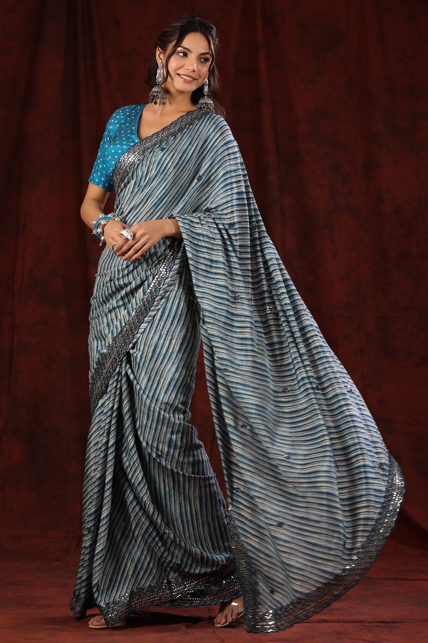 Shop blue stripes crepe saree online in USA with scalloped border. Make a fashion statement at weddings with stunning designer sarees, embroidered sarees with blouse, wedding sarees, handloom sarees from Pure Elegance Indian fashion store in USA.-pallu
