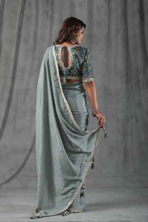 Buy sage green chevron print crepe saree online in USA with scalloped border. Make a fashion statement at weddings with stunning designer sarees, embroidered sarees with blouse, wedding sarees, handloom sarees from Pure Elegance Indian fashion store in USA.-back