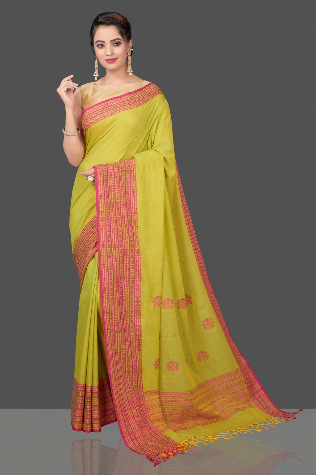 Shop beautiful pista green cotton saree online in USA with pink Assam design pallu. Flaunt Indian fashion in USA with a stunning collection of handwoven sarees, cotton sarees, pure silk sarees, designer saris in USA from Pure Elegance Indian saree store in USA.-full view