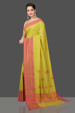 Shop beautiful pista green cotton saree online in USA with pink Assam design pallu. Flaunt Indian fashion in USA with a stunning collection of handwoven sarees, cotton sarees, pure silk sarees, designer saris in USA from Pure Elegance Indian saree store in USA.-pallu