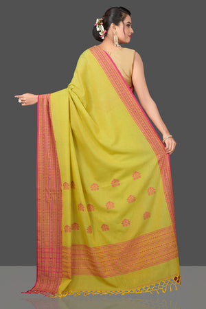 Shop beautiful pista green cotton saree online in USA with pink Assam design pallu. Flaunt Indian fashion in USA with a stunning collection of handwoven sarees, cotton sarees, pure silk sarees, designer saris in USA from Pure Elegance Indian saree store in USA.-back