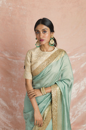 Buy gorgeous mint green embroidered handloom saree online in USA with cream embroidered saree blouse. Champion ethnic fashion on weddings and festivals with a stunning collection of designer sarees, handloom sarees with blouse, wedding sarees, from Pure Elegance Indian fashion store in USA.-closeup
