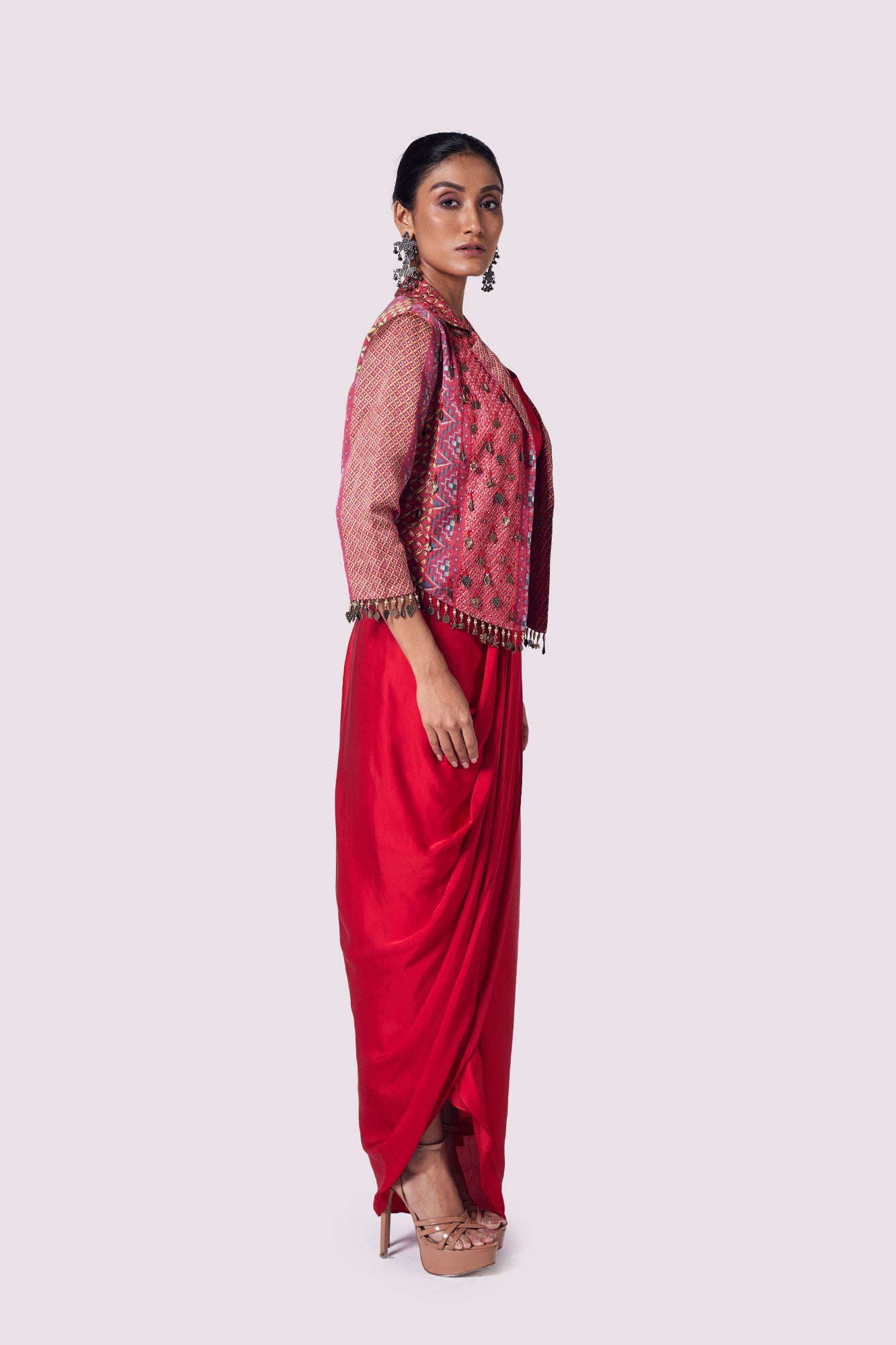 Buy red satin draped skirt with blouse online in USA and embroidered jacket. Shop the best and latest designs in embroidered sarees, designer sarees, Anarkali suit, lehengas, sharara suits for weddings and special occasions from Pure Elegance Indian fashion store in USA.-skirt
