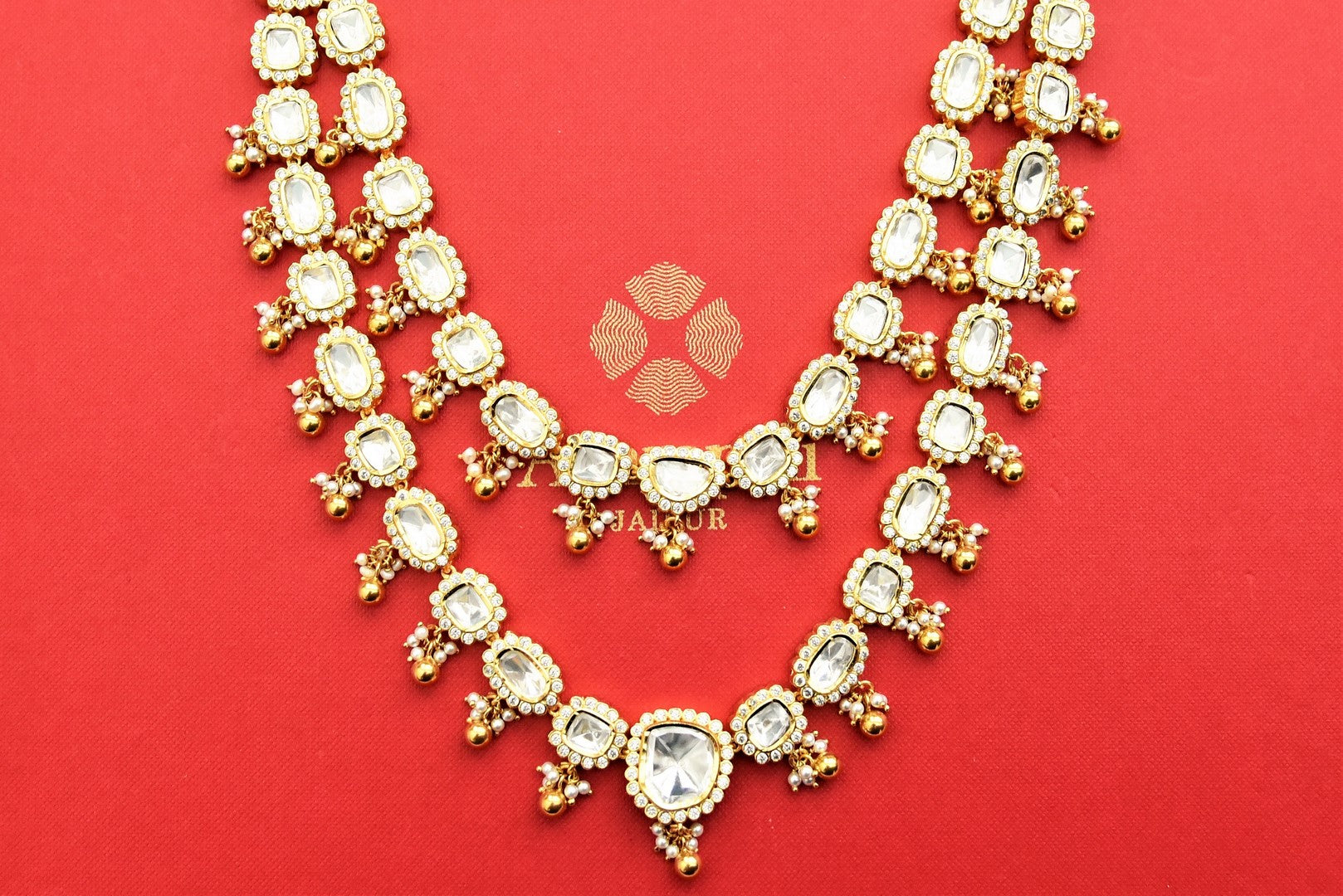 Shop stunning Amrapali gold plated layered polki necklace set online in USA. Shop gold plated jewelry, silver jewelry, gold plated earrings, wedding jewelry, bridal jewellery from Pure Elegance Indian fashion store in USA in best designs and quality.-necklace