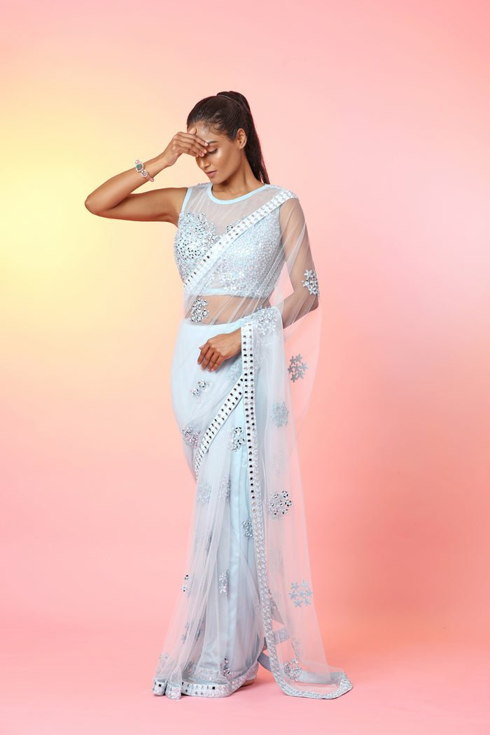 Buy stunning powder blue mirror work saree online in USA with designer blouse. Look your best at weddings and parties in Indian dresses, designer lehengas, Anarkali suits, designer gowns, salwar suits, sharara suits, embroidered sarees, designer sarees from Pure Elegance Indian fashion store in USA.-front