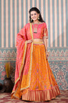 Shop the Orange and pink Bhandej print lehenga set. It is crafted in silk with intrinsic print and gotta pati embroidery on the lehenga and blouse with dupatta. Shop online from Pure Elegance.