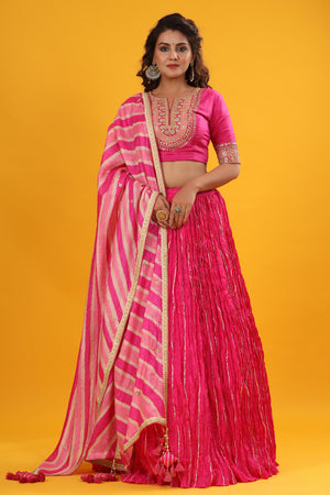 Shop a Pink gota patti embroidered set featuring silk dupatta set. It comes with a beautiful striped multicolor embroidered dupatta, pink blouse with hook closure and tie up at back. Pair it with beautiful jewelry to enhance your look. Shop online from Pure Elegance.