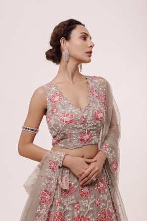 Shop this grey lehenga with a sleeveless blouse it comes with A-line bottom and blouse. Dazzle on weddings and special occasions with exquisite Indian designer dresses, sharara suits, Anarkali suits, bridal lehengas, and sharara suits from Pure Elegance Indian clothing store in the USA. Shop online from Pure Elegance.