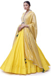 Buy beautiful yellow tussar silk embroidered lehenga online in USA with organza dupatta. Dazzle on weddings and special occasions with exquisite designer lehengas, Anarkali suit, sharara suit, Indowestern outfits, bridal lehengas from Pure Elegance Indian clothing store in the USA. -full view