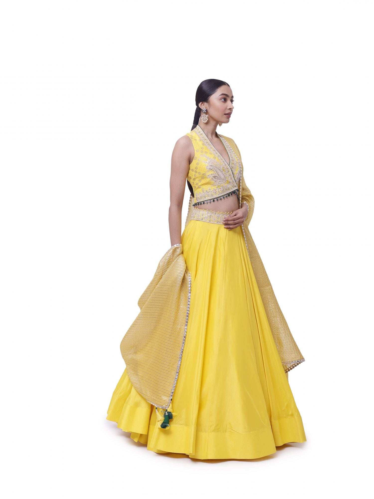 Buy beautiful yellow tussar silk embroidered lehenga online in USA with organza dupatta. Dazzle on weddings and special occasions with exquisite designer lehengas, Anarkali suit, sharara suit, Indowestern outfits, bridal lehengas from Pure Elegance Indian clothing store in the USA. -side