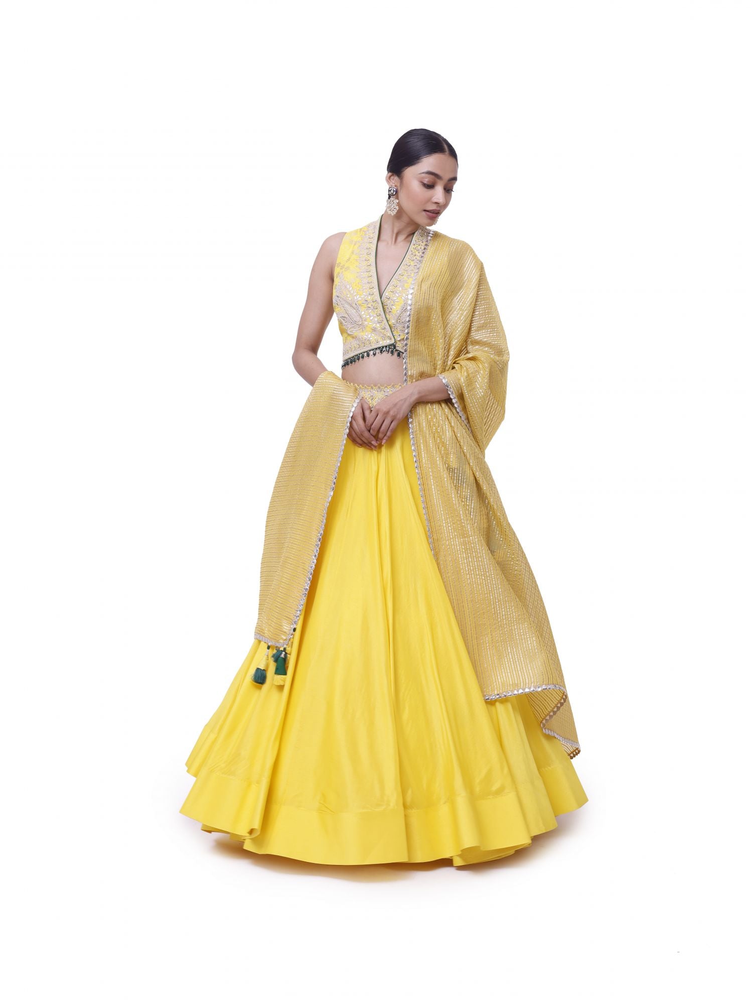 Buy beautiful yellow tussar silk embroidered lehenga online in USA with organza dupatta. Dazzle on weddings and special occasions with exquisite designer lehengas, Anarkali suit, sharara suit, Indowestern outfits, bridal lehengas from Pure Elegance Indian clothing store in the USA. -front