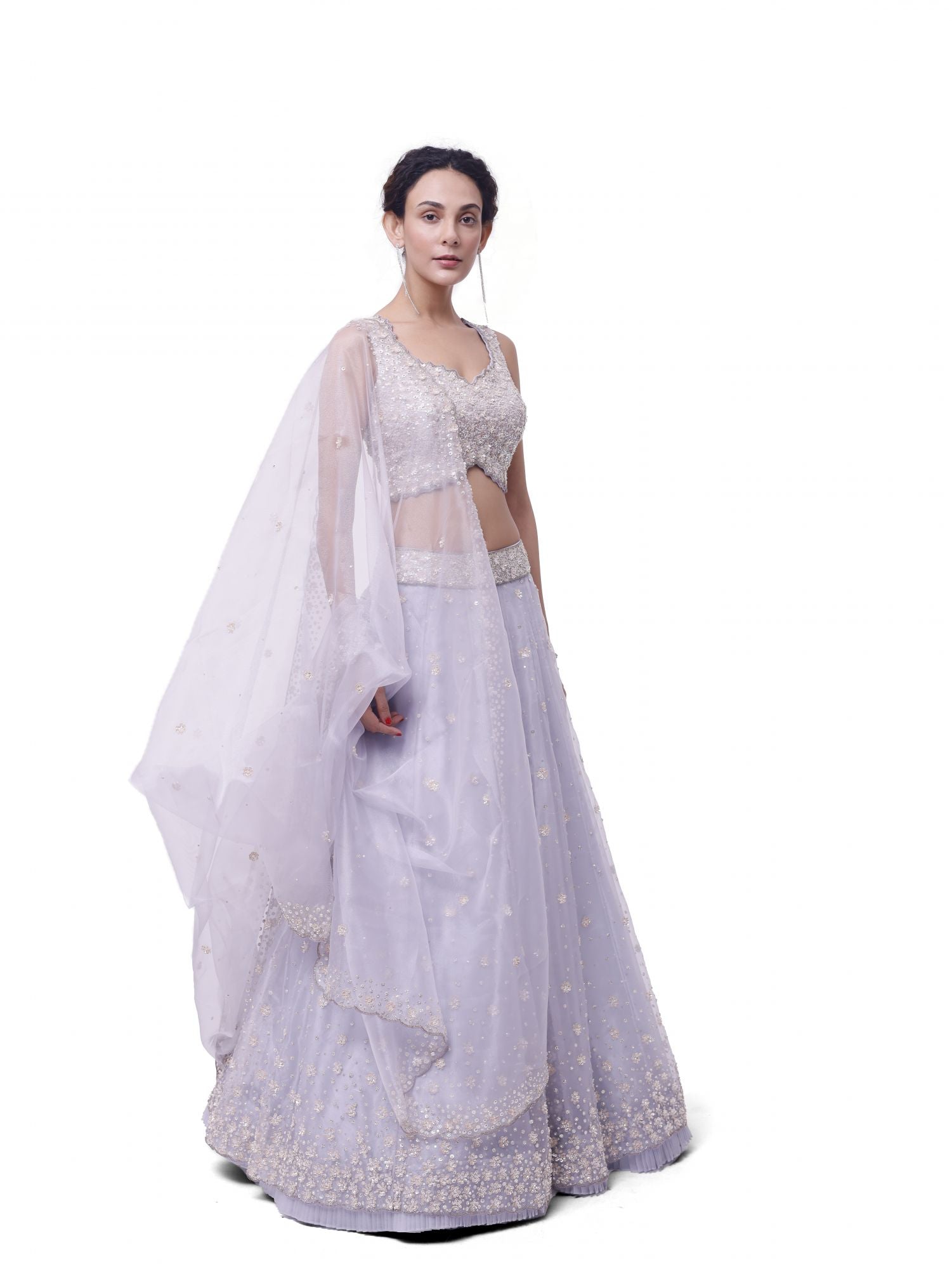 Shop silver tissue embroidered lehenga online in USA with upatta. Dazzle on weddings and special occasions with exquisite designer lehengas, Anarkali suit, sharara suit, Indowestern outfits, bridal lehengas from Pure Elegance Indian clothing store in the USA. -side
