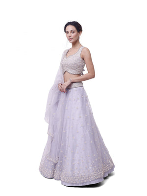 Shop silver tissue embroidered lehenga online in USA with upatta. Dazzle on weddings and special occasions with exquisite designer lehengas, Anarkali suit, sharara suit, Indowestern outfits, bridal lehengas from Pure Elegance Indian clothing store in the USA. -lehenga