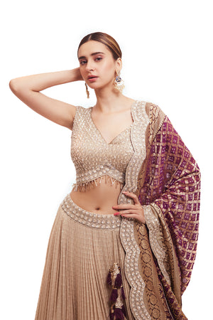 Buy off-white embroidered lehenga online in USA with purple zari dupatta. Dazzle on weddings and special occasions with exquisite designer lehengas, Anarkali suit, sharara suit, Indowestern outfits, bridal lehengas from Pure Elegance Indian clothing store in the USA. -closeup