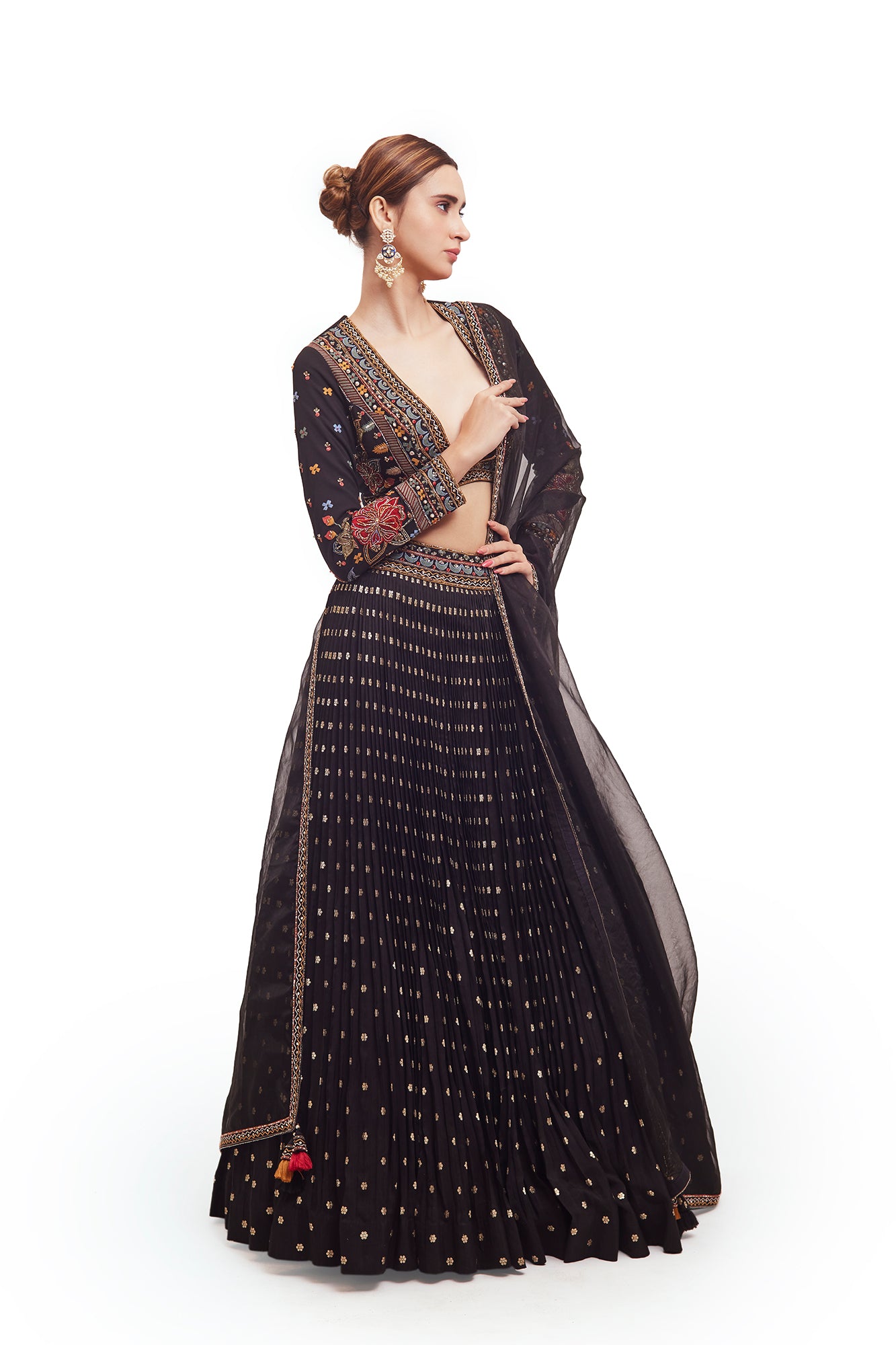 Shop beautiful black raw silk lehenga online in USA with multicolor embroidery. Dazzle on weddings and special occasions with exquisite designer lehengas, Anarkali suit, sharara suit, Indowestern outfits, bridal lehengas from Pure Elegance Indian clothing store in the USA. -side
