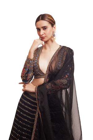 Shop beautiful black raw silk lehenga online in USA with multicolor embroidery. Dazzle on weddings and special occasions with exquisite designer lehengas, Anarkali suit, sharara suit, Indowestern outfits, bridal lehengas from Pure Elegance Indian clothing store in the USA. -closeup