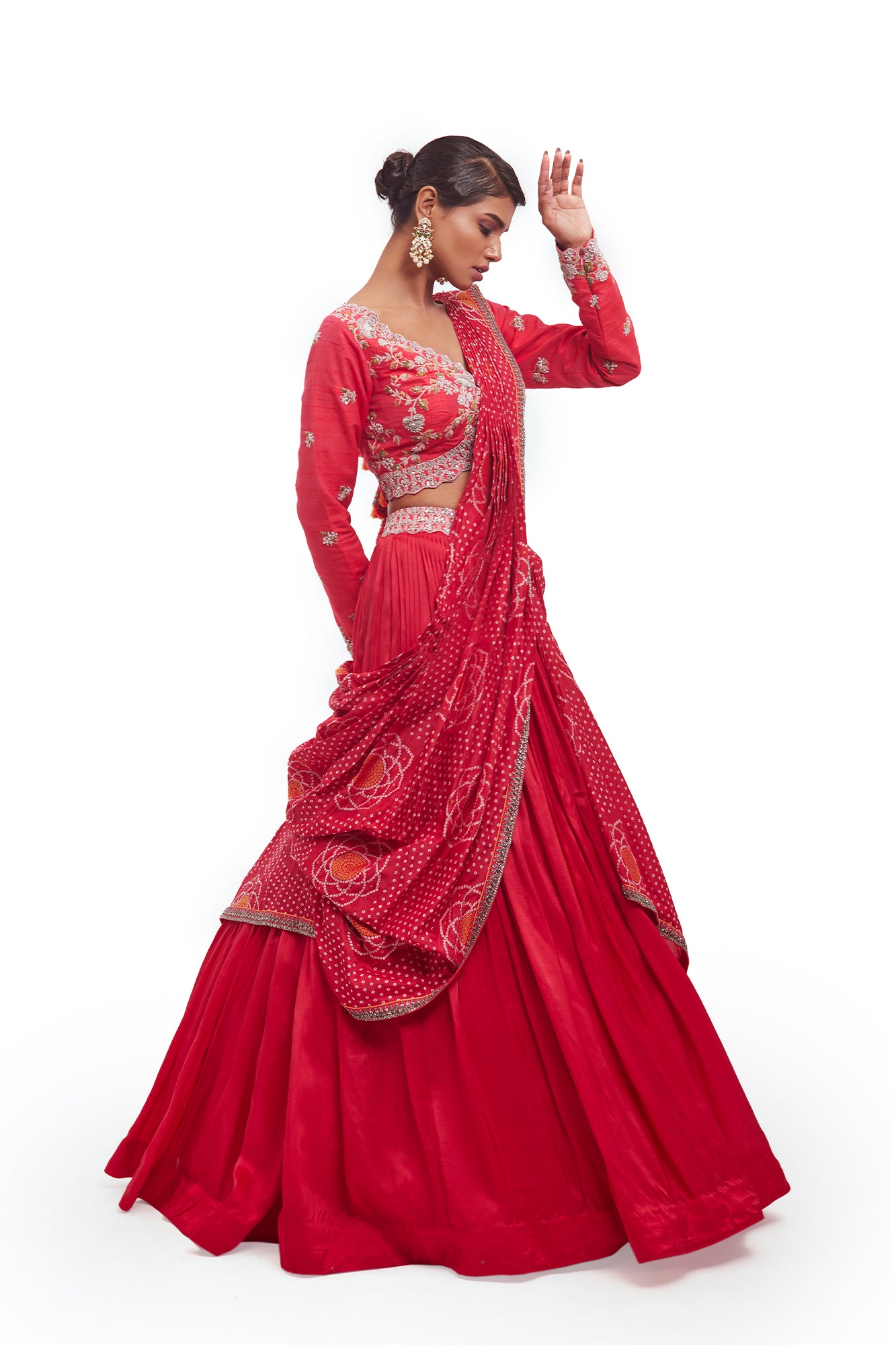 Buy beautiful rani pink embroidered Bandhej silk lehenga online in USA with dupatta. Dazzle on weddings and special occasions with exquisite designer lehengas, Anarkali suit, sharara suit, Indowestern outfits, bridal lehengas from Pure Elegance Indian clothing store in the USA. -side