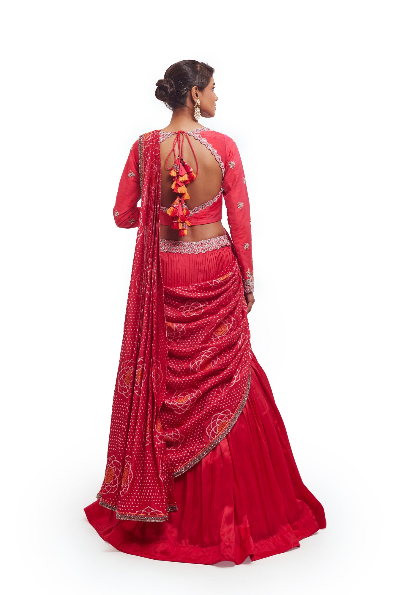 Buy beautiful rani pink embroidered Bandhej silk lehenga online in USA with dupatta. Dazzle on weddings and special occasions with exquisite designer lehengas, Anarkali suit, sharara suit, Indowestern outfits, bridal lehengas from Pure Elegance Indian clothing store in the USA. -back