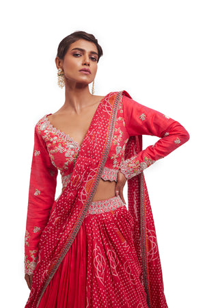 Buy beautiful rani pink embroidered Bandhej silk lehenga online in USA with dupatta. Dazzle on weddings and special occasions with exquisite designer lehengas, Anarkali suit, sharara suit, Indowestern outfits, bridal lehengas from Pure Elegance Indian clothing store in the USA. -closeup