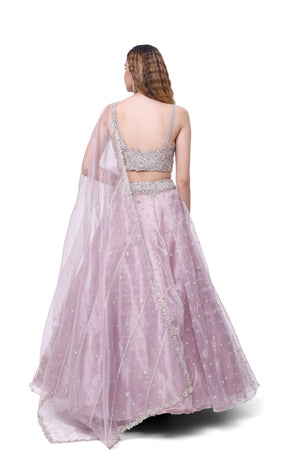Shop lavender embroidered tissue lehenga online in USA with dupatta. Dazzle on weddings and special occasions with exquisite designer lehengas, Anarkali suit, sharara suit, Indowestern outfits, bridal lehengas from Pure Elegance Indian clothing store in the USA. -back