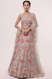 Buy greige embroidered organza lehenga online in USA with dupatta. Dazzle on weddings and special occasions with exquisite designer lehengas, Anarkali suit, sharara suit, Indowestern outfits, bridal lehengas from Pure Elegance Indian clothing store in the USA. -full view