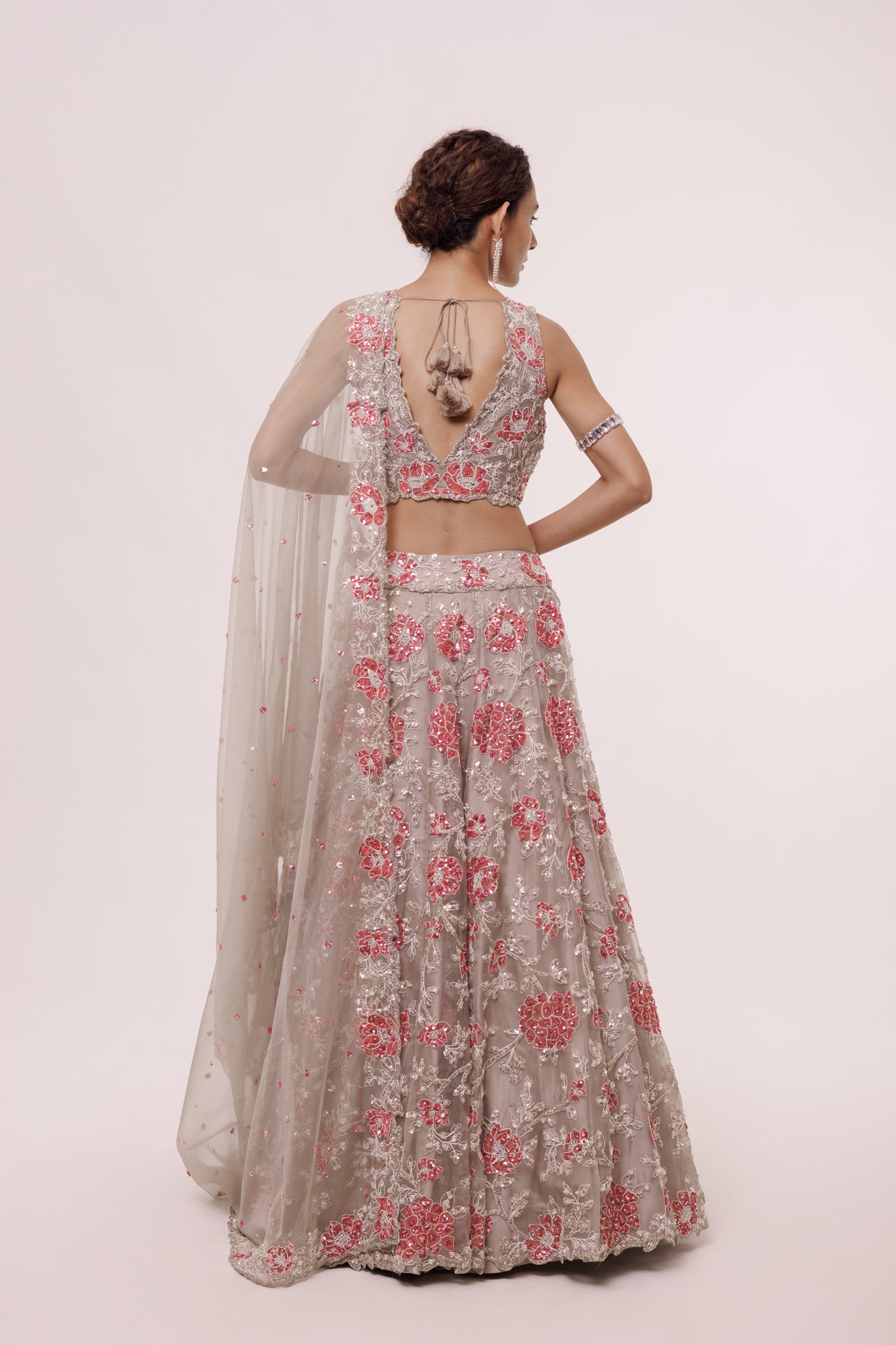 Buy greige embroidered organza lehenga online in USA with dupatta. Dazzle on weddings and special occasions with exquisite designer lehengas, Anarkali suit, sharara suit, Indowestern outfits, bridal lehengas from Pure Elegance Indian clothing store in the USA. -back
