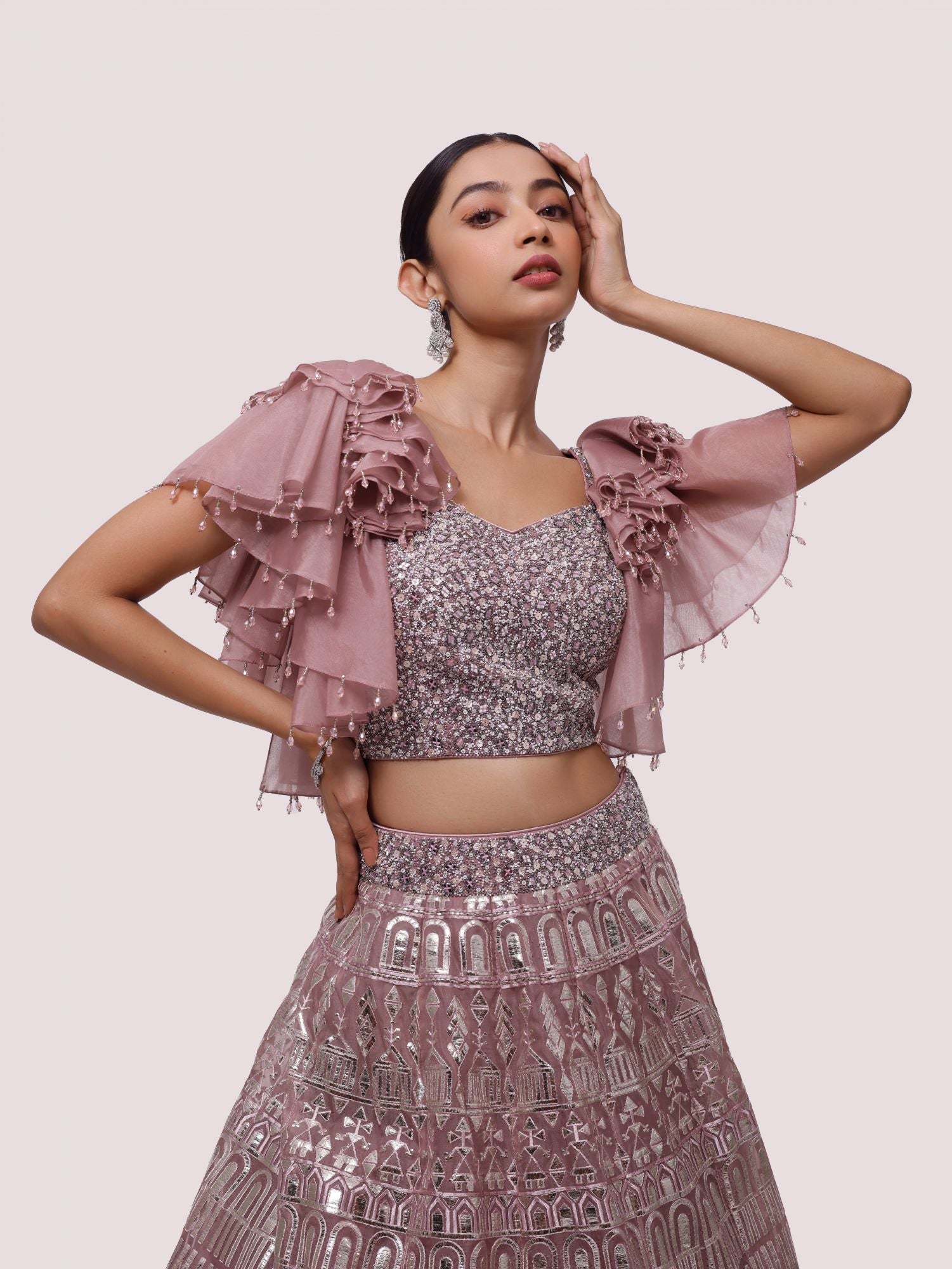 Buy dusty rose pink embroidered organza lehenga online in USA. Dazzle on weddings and special occasions with exquisite designer lehengas, Anarkali suit, sharara suit, Indowestern outfits, bridal lehengas from Pure Elegance Indian clothing store in the USA. -closeup