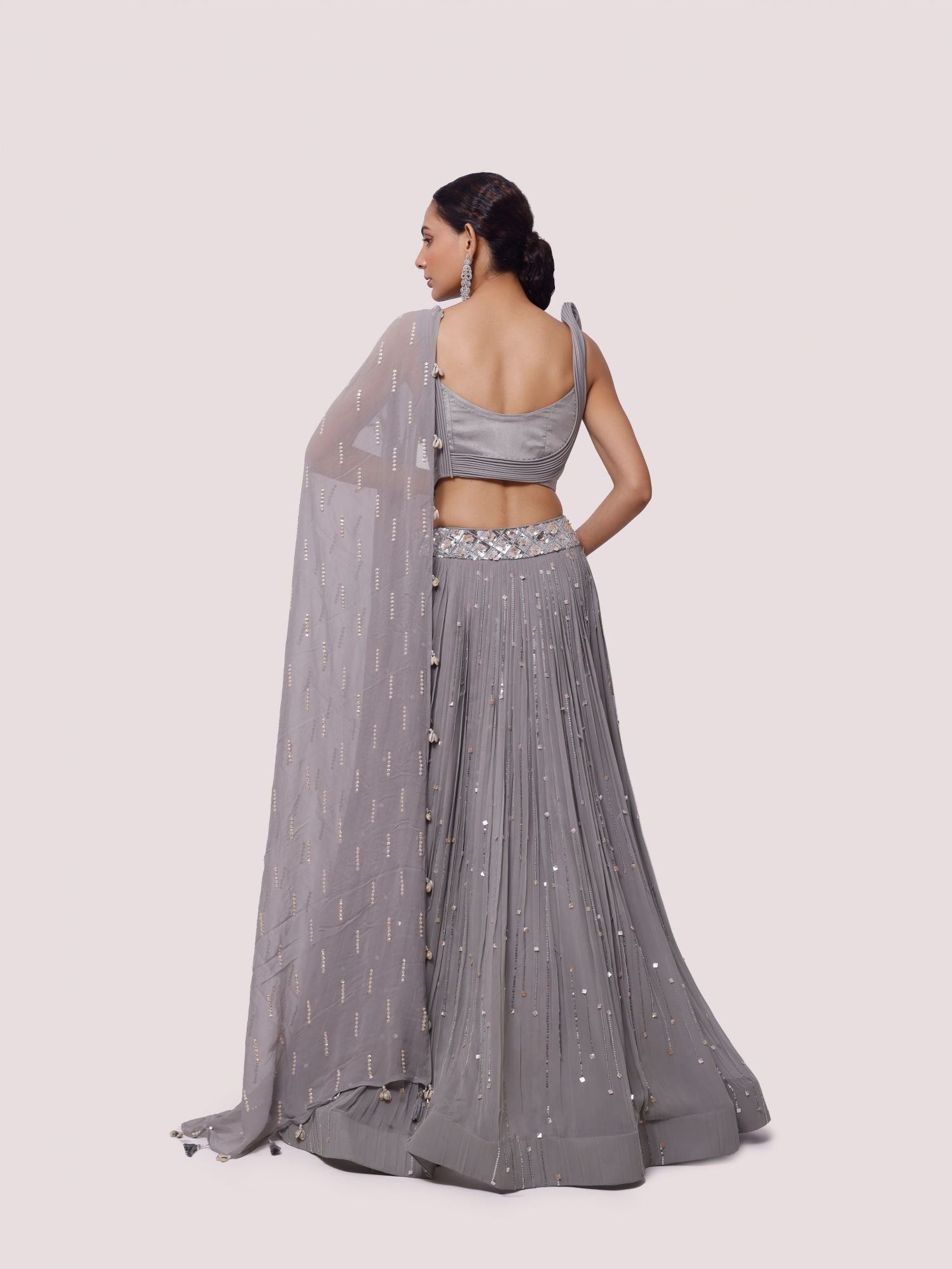 Buy grey hand embroidered contemporary georgette lehenga online in USA. Dazzle on weddings and special occasions with exquisite designer lehengas, Anarkali suit, sharara suit, Indowestern outfits, bridal lehengas from Pure Elegance Indian clothing store in the USA. -back