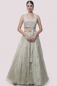 Shop pista green embroidered satin and organza lehenga online in USA with dupatta. Dazzle on weddings and special occasions with exquisite designer lehengas, Anarkali suit, sharara suit, Indowestern outfits, bridal lehengas from Pure Elegance Indian clothing store in the USA. -full view