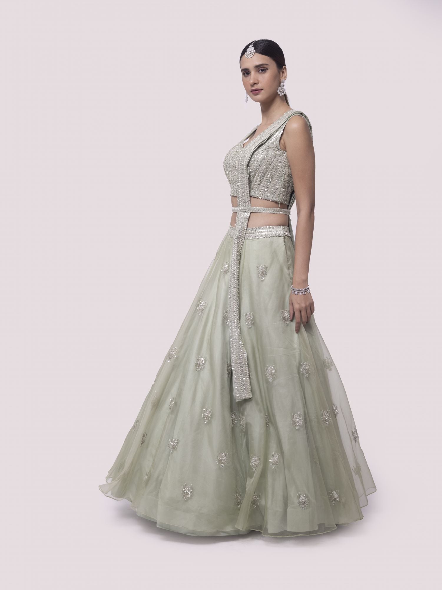 Shop pista green embroidered satin and organza lehenga online in USA with dupatta. Dazzle on weddings and special occasions with exquisite designer lehengas, Anarkali suit, sharara suit, Indowestern outfits, bridal lehengas from Pure Elegance Indian clothing store in the USA. -lehenga
