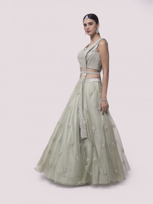 Shop pista green embroidered satin and organza lehenga online in USA with dupatta. Dazzle on weddings and special occasions with exquisite designer lehengas, Anarkali suit, sharara suit, Indowestern outfits, bridal lehengas from Pure Elegance Indian clothing store in the USA. -lehenga