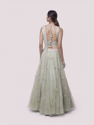 Shop pista green embroidered satin and organza lehenga online in USA with dupatta. Dazzle on weddings and special occasions with exquisite designer lehengas, Anarkali suit, sharara suit, Indowestern outfits, bridal lehengas from Pure Elegance Indian clothing store in the USA. -back