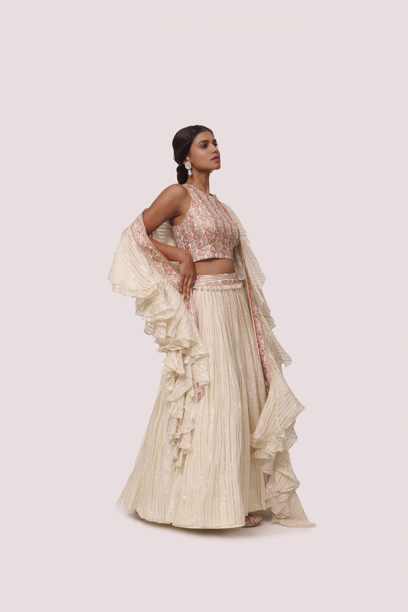 Shop beautiful off-white printed silk and organza lehenga online in USA with aari work. Dazzle on weddings and special occasions with exquisite designer lehengas, Anarkali suit, sharara suit, Indowestern outfits, bridal lehengas from Pure Elegance Indian clothing store in the USA. -side