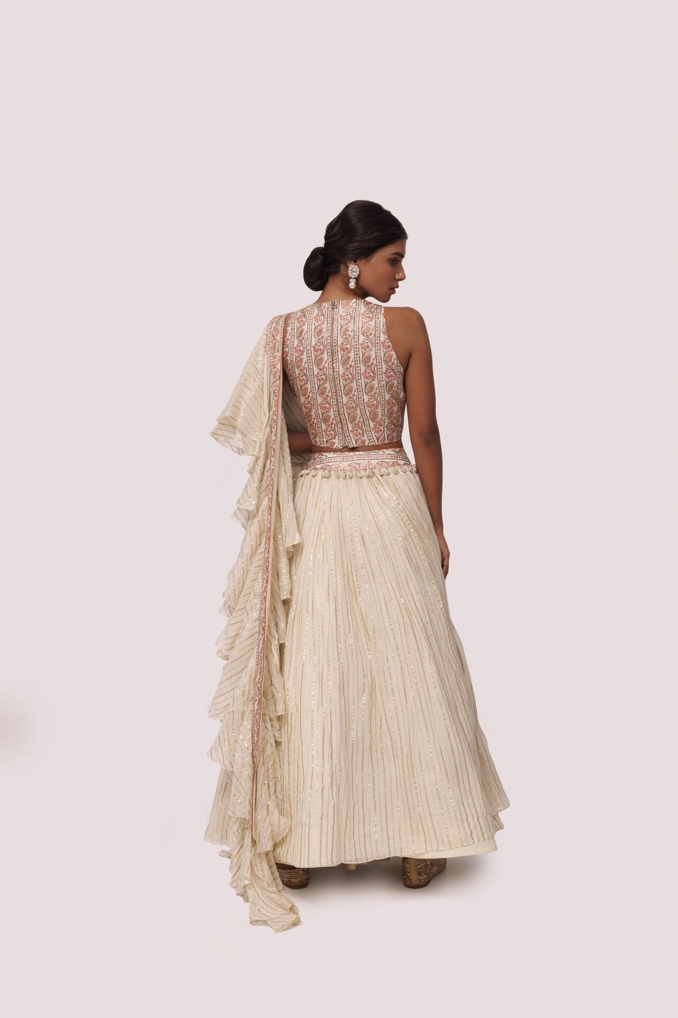 Shop beautiful off-white printed silk and organza lehenga online in USA with aari work. Dazzle on weddings and special occasions with exquisite designer lehengas, Anarkali suit, sharara suit, Indowestern outfits, bridal lehengas from Pure Elegance Indian clothing store in the USA. -back