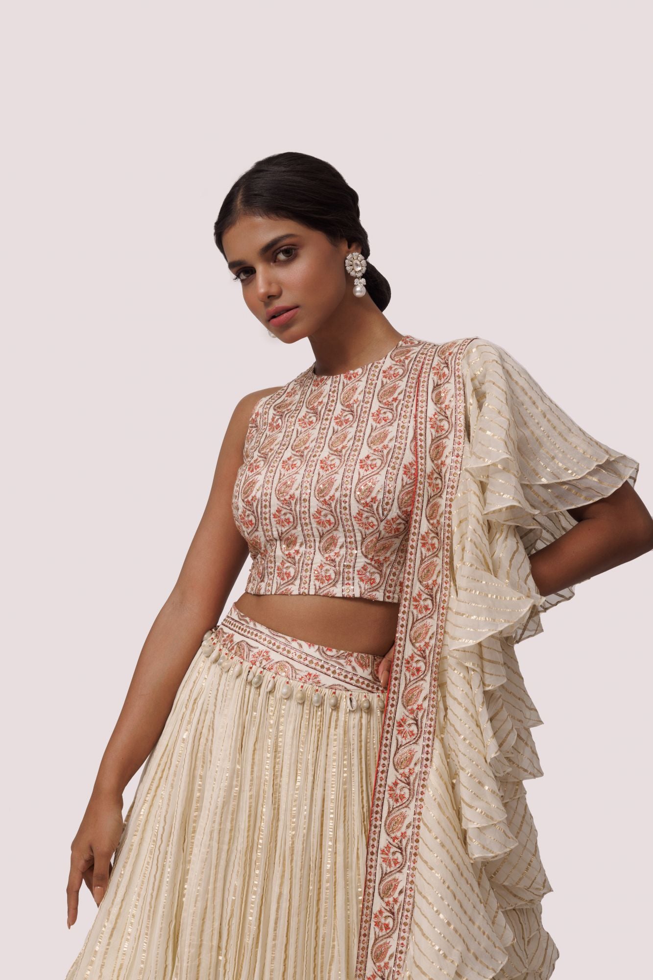 Shop beautiful off-white printed silk and organza lehenga online in USA with aari work. Dazzle on weddings and special occasions with exquisite designer lehengas, Anarkali suit, sharara suit, Indowestern outfits, bridal lehengas from Pure Elegance Indian clothing store in the USA. -closeup