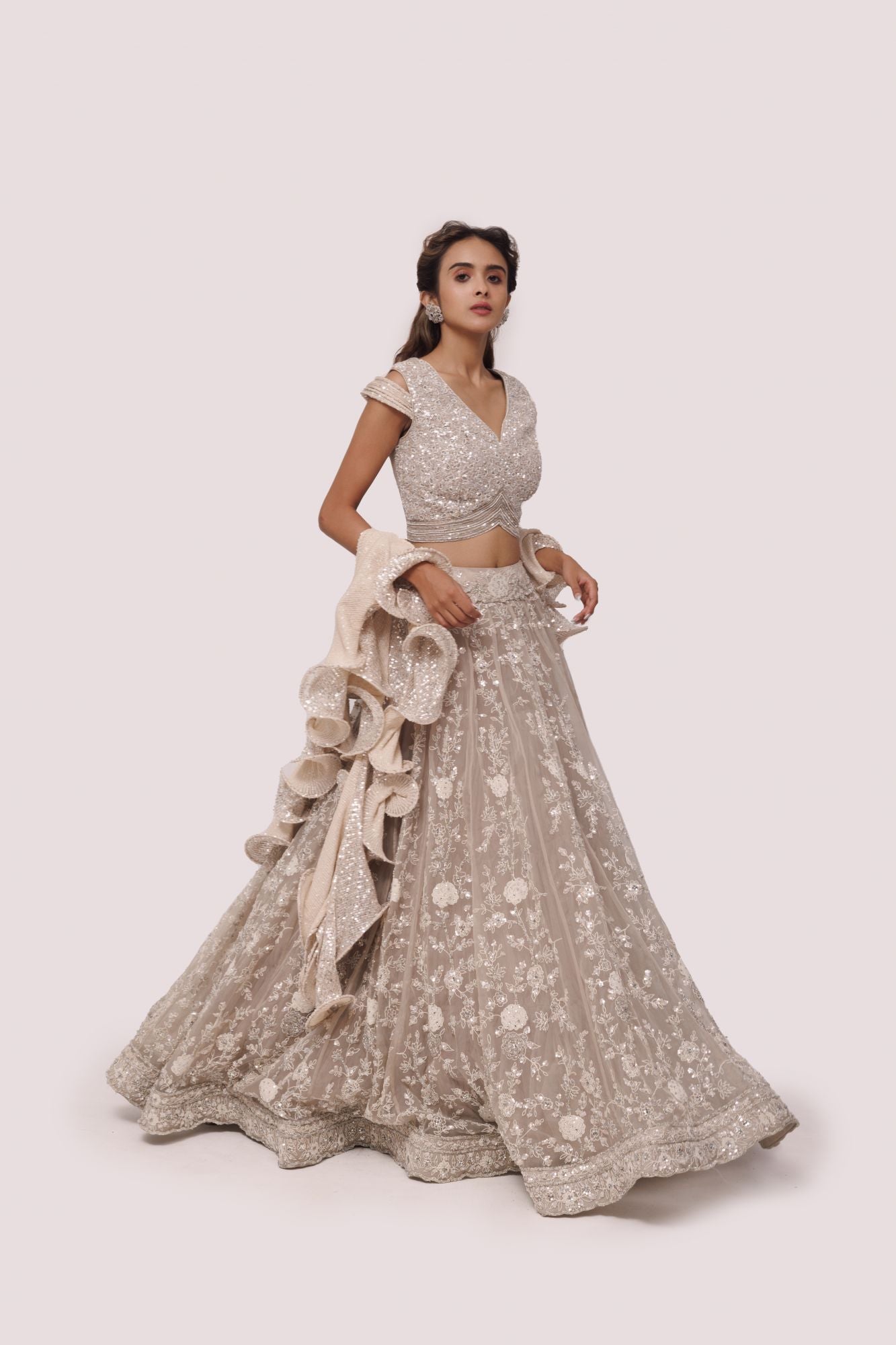 Shop bone white embroidered net and organza lehenga online in USA. Dazzle on weddings and special occasions with exquisite designer lehengas, Anarkali suit, sharara suit, Indowestern outfits, bridal lehengas from Pure Elegance Indian clothing store in the USA. -side
