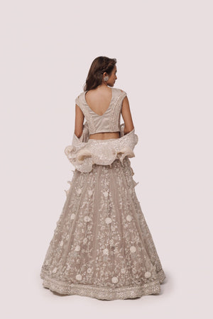 Shop bone white embroidered net and organza lehenga online in USA. Dazzle on weddings and special occasions with exquisite designer lehengas, Anarkali suit, sharara suit, Indowestern outfits, bridal lehengas from Pure Elegance Indian clothing store in the USA. -back