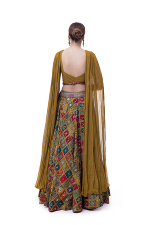 Shop mustard georgette silk skirt online in USA with pleated top. Dazzle on weddings and special occasions with exquisite designer lehengas, Anarkali suit, sharara suit, Indowestern outfits, bridal lehengas from Pure Elegance Indian clothing store in the USA. -back