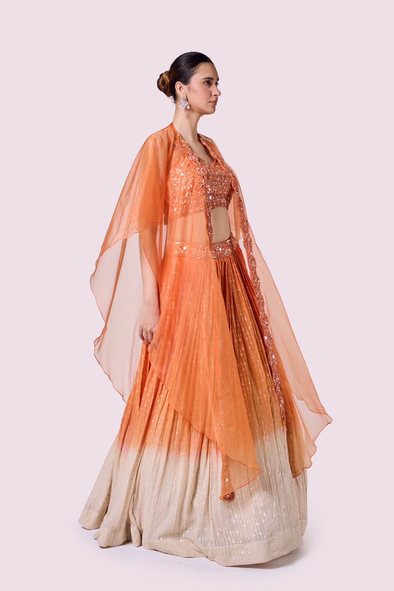 Shop beautiful orange embellished chikan lehenga online in USA with dupatta. Shop the best and latest designs in embroidered sarees, designer sarees, Anarkali suit, lehengas, sharara suits for weddings and special occasions from Pure Elegance Indian fashion store in USA.-side