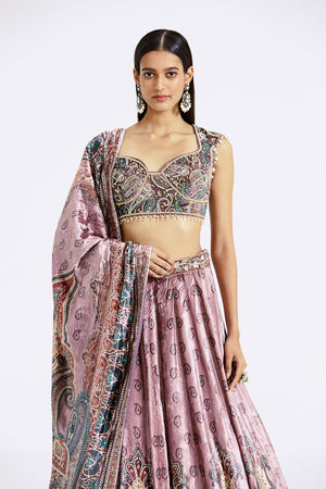 Shop onion pink printed and embroidered velvet lehenga online in USA. Shop the best and latest designs in embroidered sarees, designer sarees, Anarkali suit, lehengas, sharara suits for weddings and special occasions from Pure Elegance Indian fashion store in USA.-closeup
