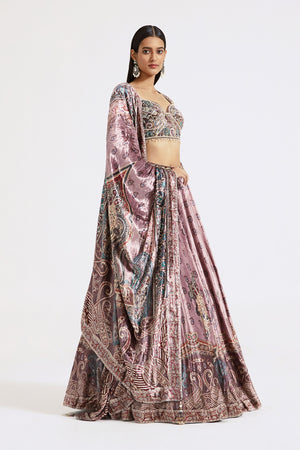 Shop onion pink printed and embroidered velvet lehenga online in USA. Shop the best and latest designs in embroidered sarees, designer sarees, Anarkali suit, lehengas, sharara suits for weddings and special occasions from Pure Elegance Indian fashion store in USA.-side