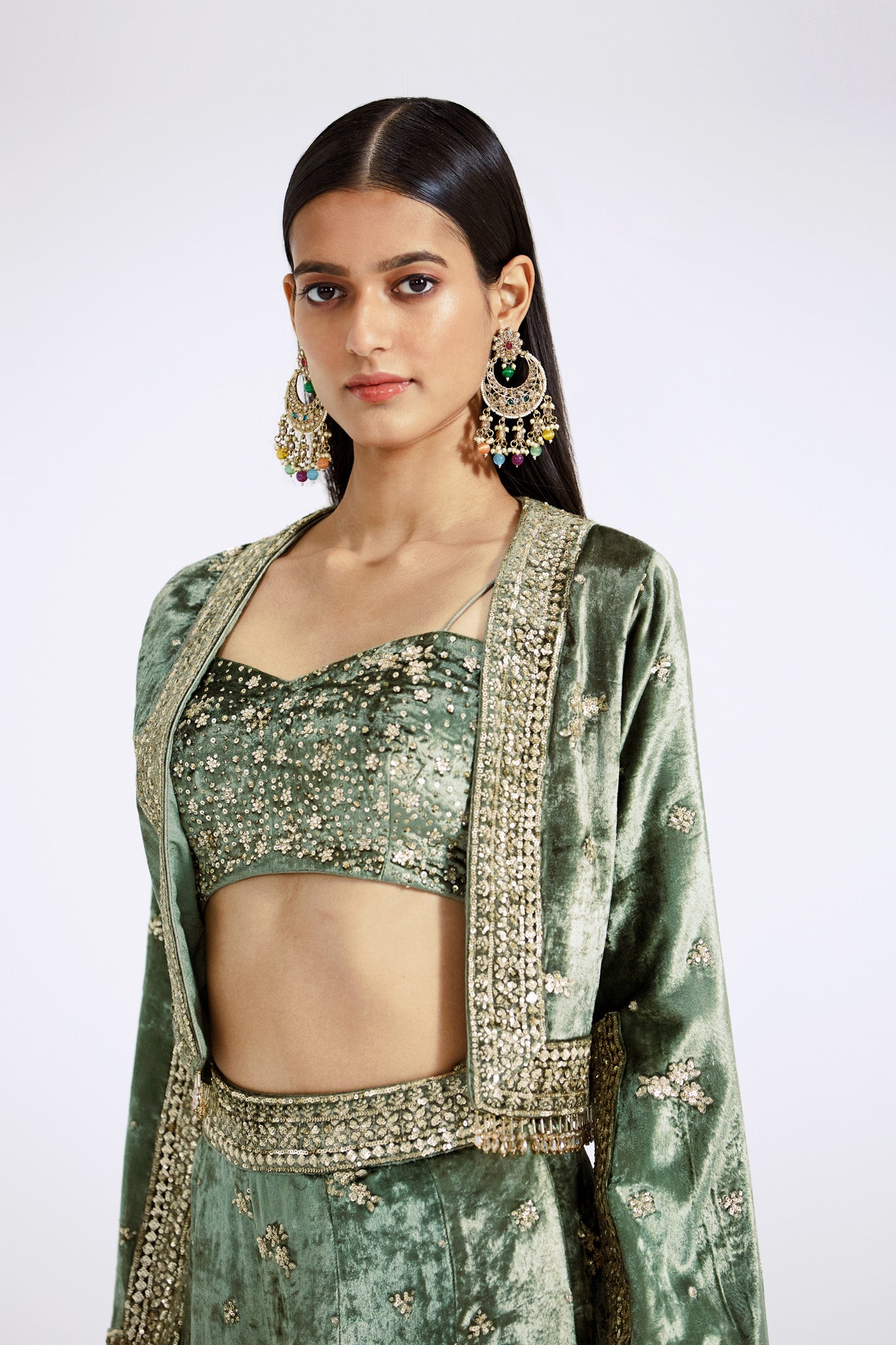Buy green embroidered contemporary velvet sharara set online in USA with cape. Shop the best and latest designs in embroidered sarees, designer sarees, Anarkali suit, lehengas, sharara suits for weddings and special occasions from Pure Elegance Indian fashion store in USA.-closeup