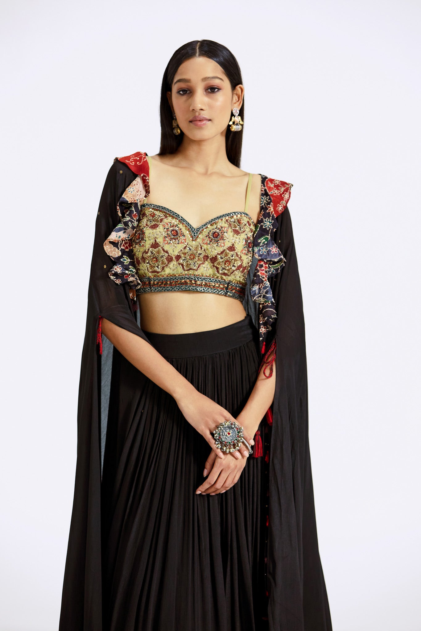 Buy black applique work skirt and bustier set online in USA with cape. Shop the best and latest designs in embroidered sarees, designer sarees, Anarkali suit, lehengas, sharara suits for weddings and special occasions from Pure Elegance Indian fashion store in USA.-closeup