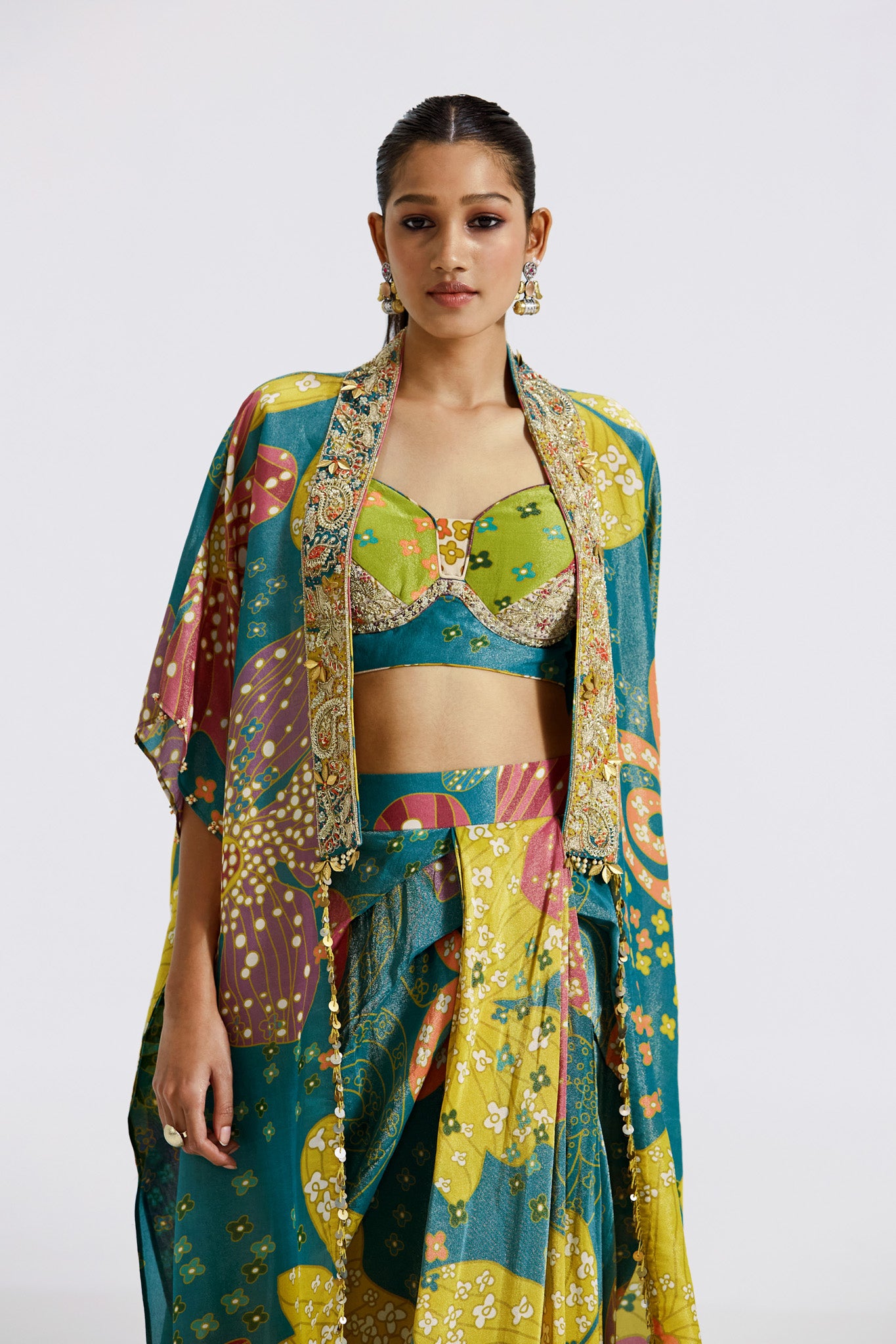 Buy stunning multicolor print crepe draped skirt set online in USA with cape. Shop the best and latest designs in embroidered sarees, designer sarees, Anarkali suit, lehengas, sharara suits for weddings and special occasions from Pure Elegance Indian fashion store in USA.-closeup